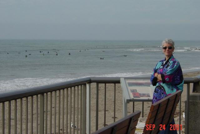 Kathleen at Ventura beach w old geezer surfers in background.JPG